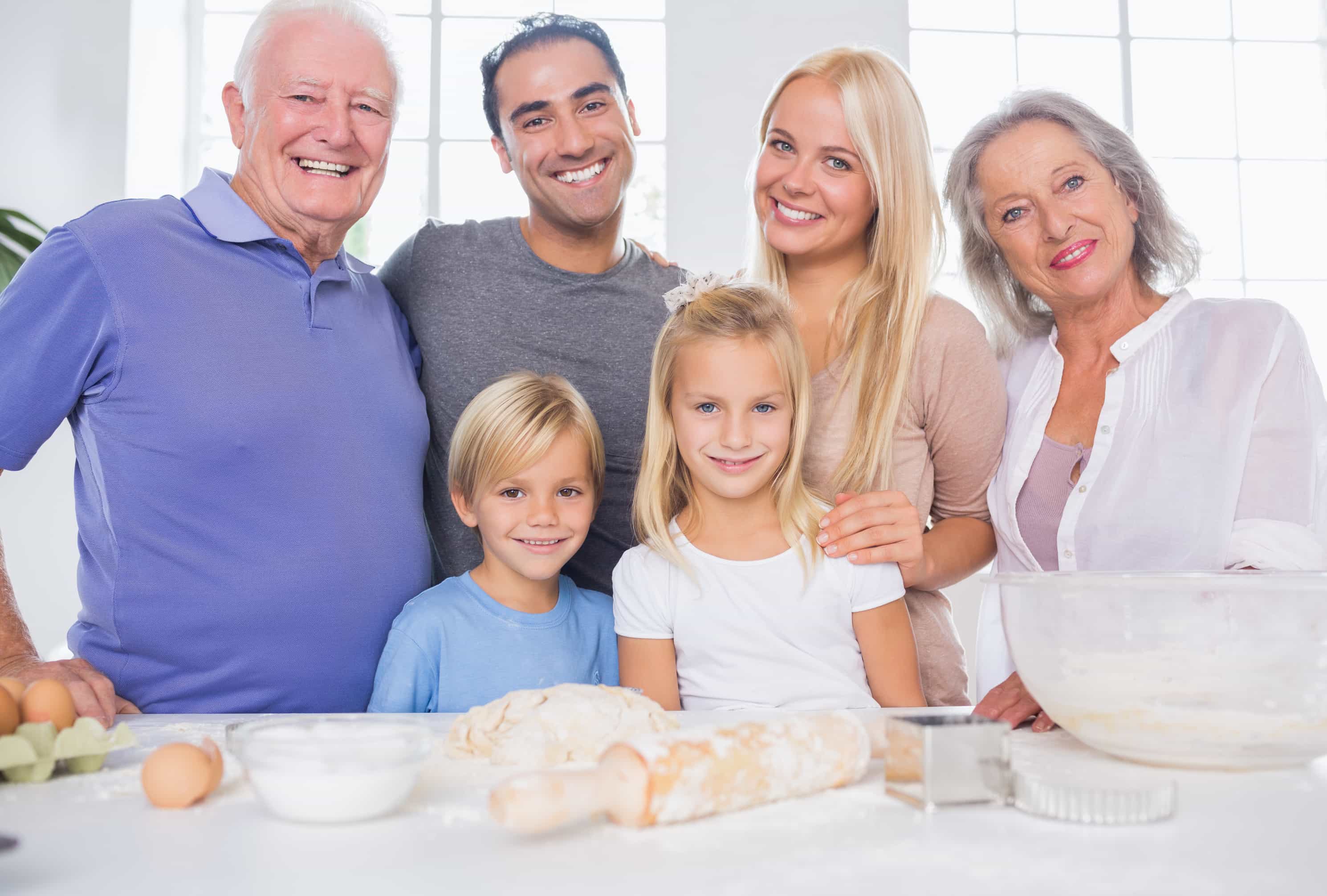 Family posing in the kitchen in front of kitchen utensils – TermQuote